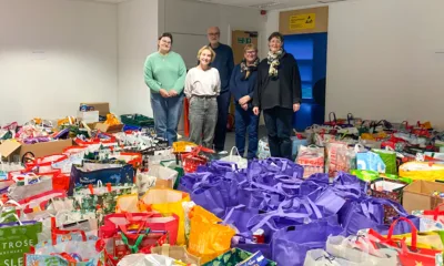Local organiser, Kate McIntosh (L) and foodbank volunteers with donated hampers