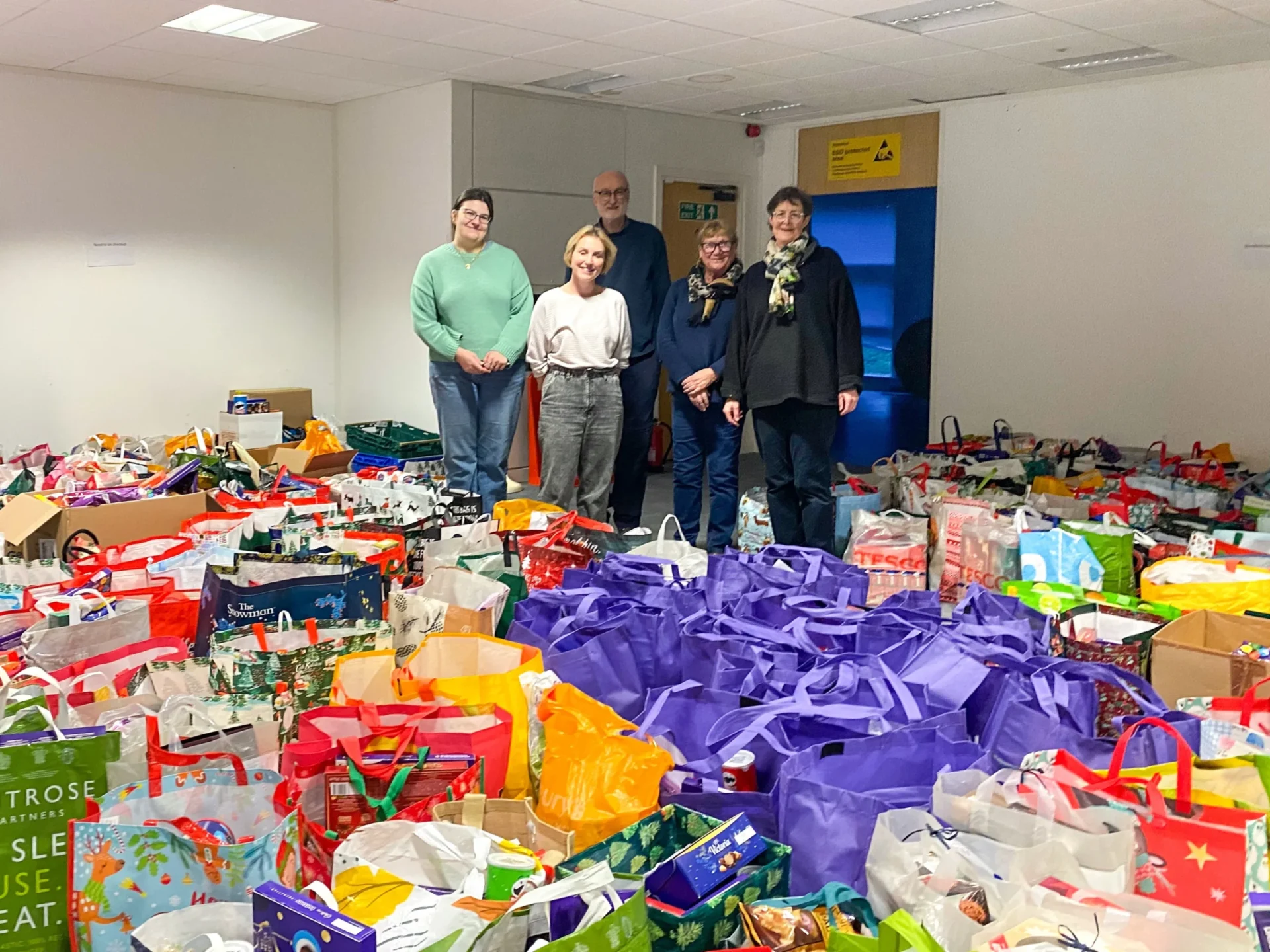 hampers - News for Peterborough and Cambridgeshire News for Peterborough and Cambridgeshire - Local organiser, Kate McIntosh (L) and foodbank volunteers with donated hampers