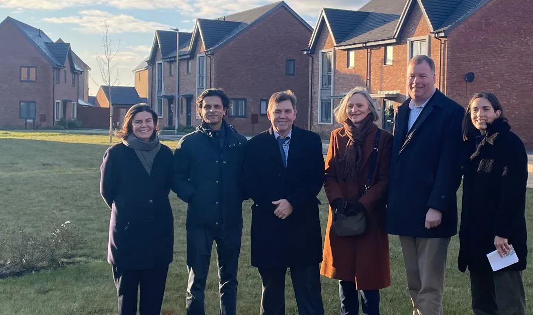 At the completed housing site, from left, Poly Bradshaw and Shamez Alibhai of Man GPM, Mayor Dr Nik Johnson, Huntingdonshire district councillors Ann Blackwell and Tom Sanderson, and Carmen Cacicedo Jaroszynska, also of Man GPM.
