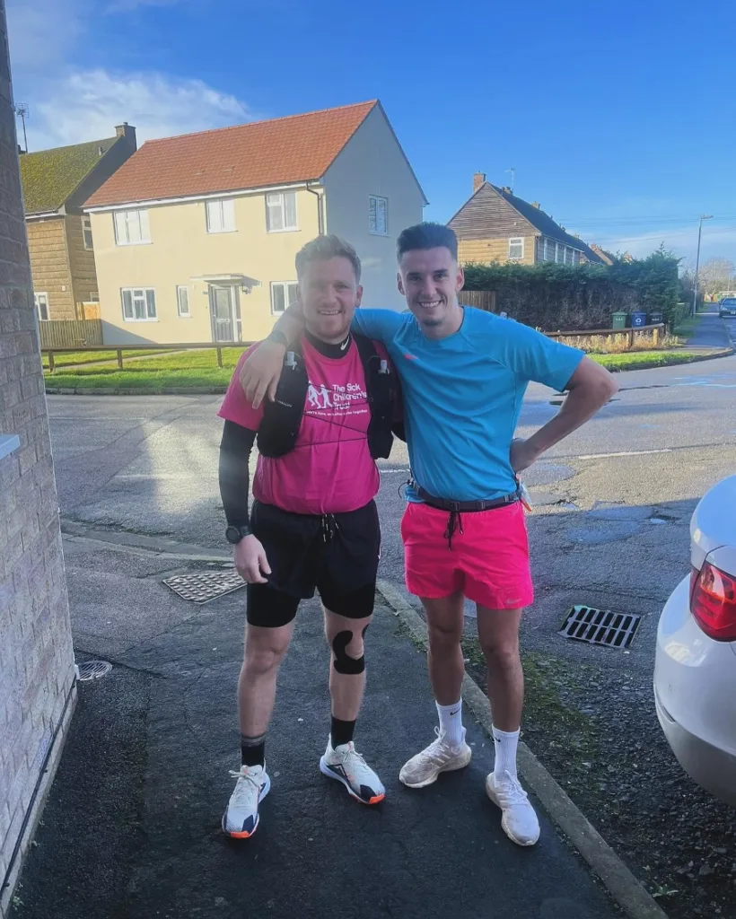 Daniel Peck (left), pictured alongside Tom Wood, one of numerous runners who supported Daniel during the 496 Challenge. Credit: Daniel Peck.  