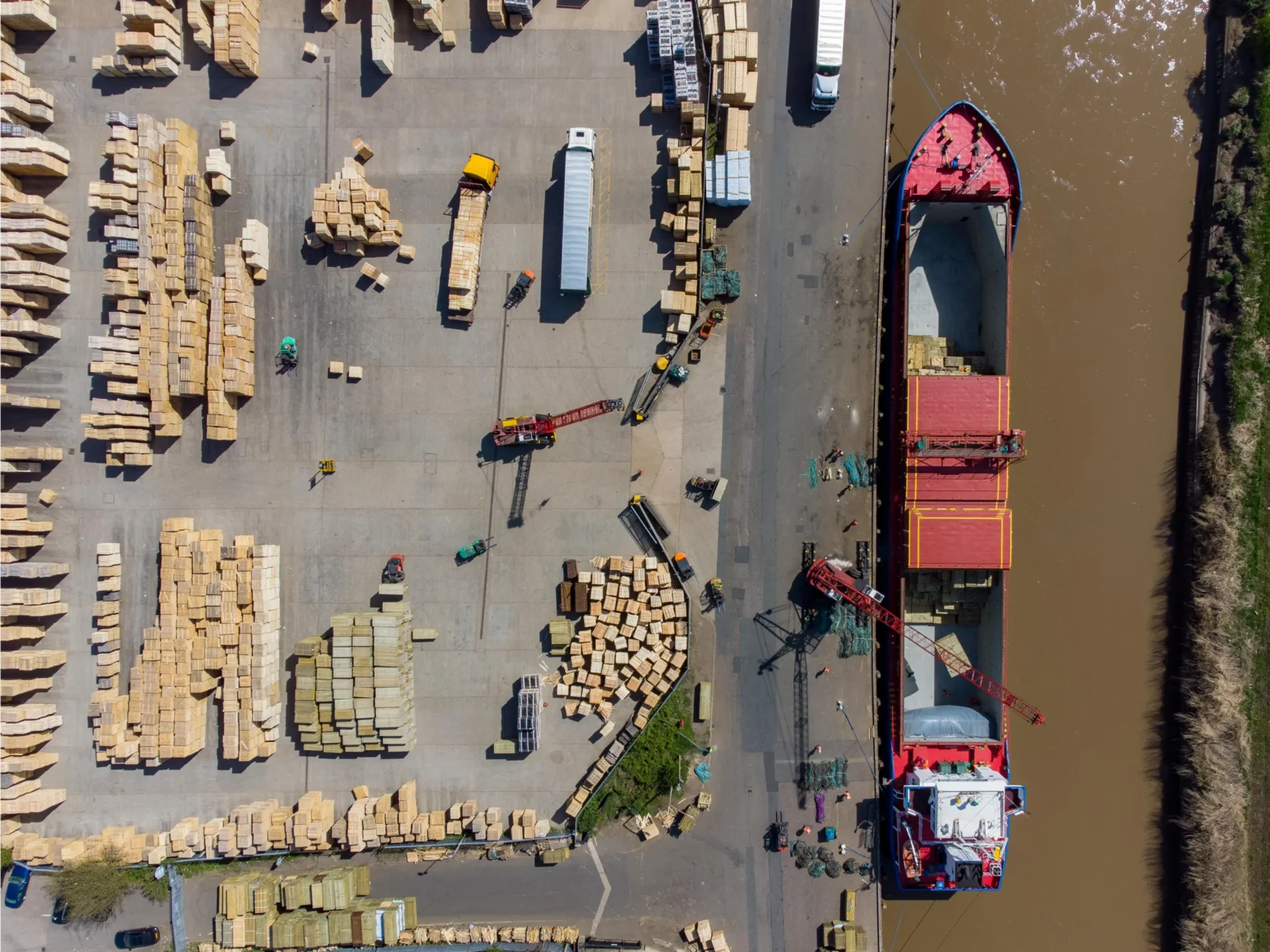 Timber being off-loaded from the Storetbeker (Gibralter) at the Port of Wisbech - News for Peterborough and Cambridgeshire News for Peterborough and Cambridgeshire - Wisbech Port has applied for an environmental permit to allow it to operate as a transfer station to allow for the storage of 75,000 tonnes of baled RDF (Refuse Derived Fuel) prior to export to the continent. PHOTO: Terry Harris