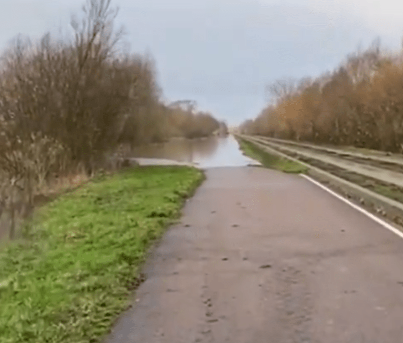 Photos from Cambridgeshire County Council show the maintenance track of the guided busway flooded between Swavesey and St Ives 
