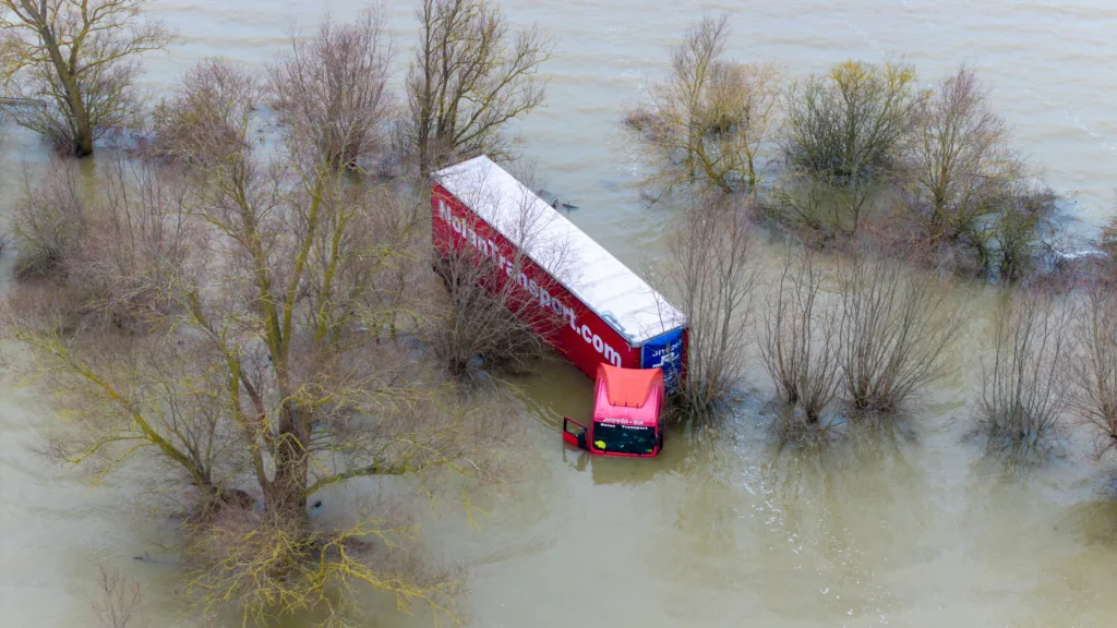 Well and truly stuck: The truck and trailer owned by Nolan Transport that attempted an unsuccessful crossing of Welney Wash road today. PHOTO: Bav Media 