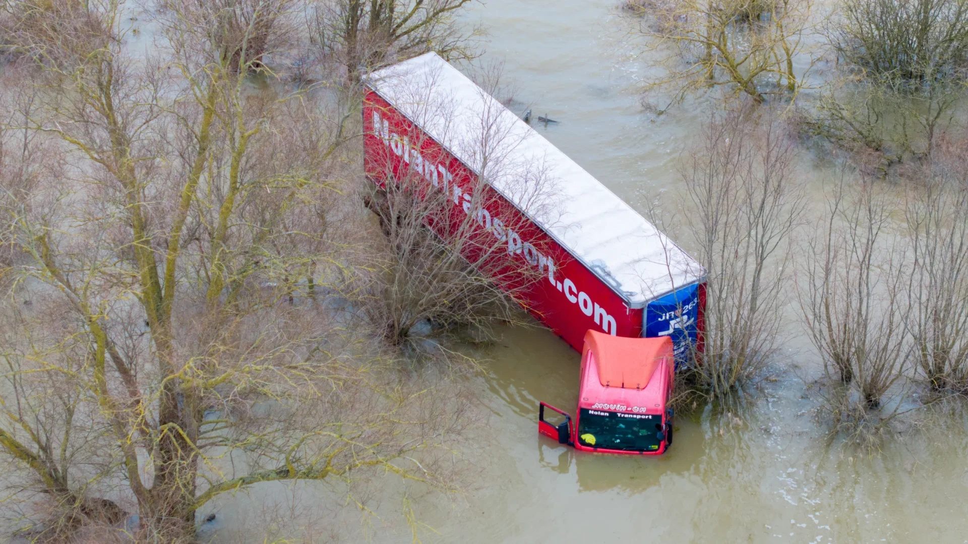 Well and truly stuck: The truck and trailer owned by Nolan Transport that attempted an unsuccessful crossing of Welney Wash road today. PHOTO: Bav Media