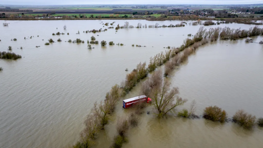 Recovery team from Manchetts were praised for their efforts in retrieving this cab and trailer that the driver was forced to abandon in the early hours of Monday on the flooded A1101 Welney Wash Road. PHOTO: Bav Media 