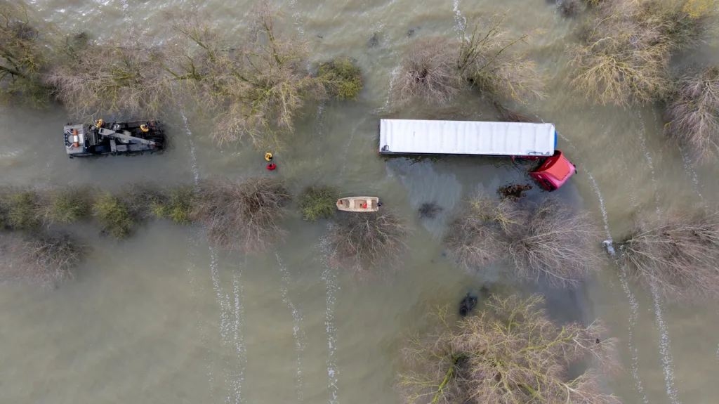 Recovery team from Manchetts were praised for their efforts in retrieving this cab and trailer that the driver was forced to abandon in the early hours of Monday on the flooded A1101 Welney Wash Road. PHOTO: Bav Media 