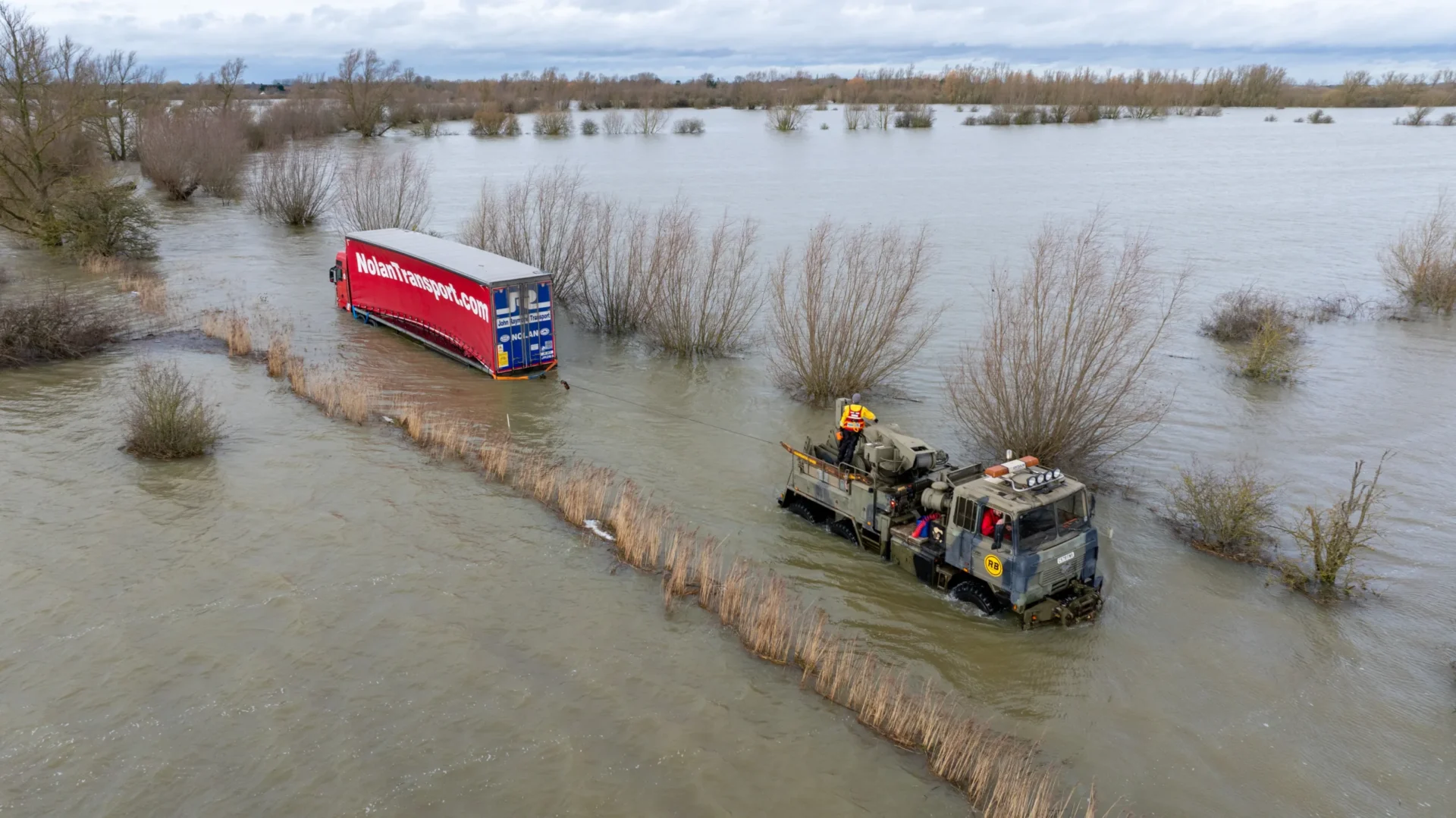 Lorry recovery floods - News for Peterborough and Cambridgeshire News for Peterborough and Cambridgeshire - Recovery team from Manchetts were praised for their efforts in retrieving this cab and trailer that the driver was forced to abandon in the early hours of Monday on the flooded A1101 Welney Wash Road. PHOTO: Bav Media