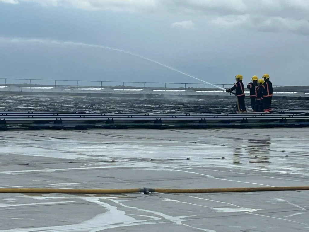 Scenes from today’s fire at the Lidl distribution depot in Peterborough. At one stage some 60 firefighters were brought in to tackle – and contain – the fire after solar panels on the roof caught fire. PHOTOS: Terry Harris for CambsNews and Cambridgeshire Fire and Rescue 
