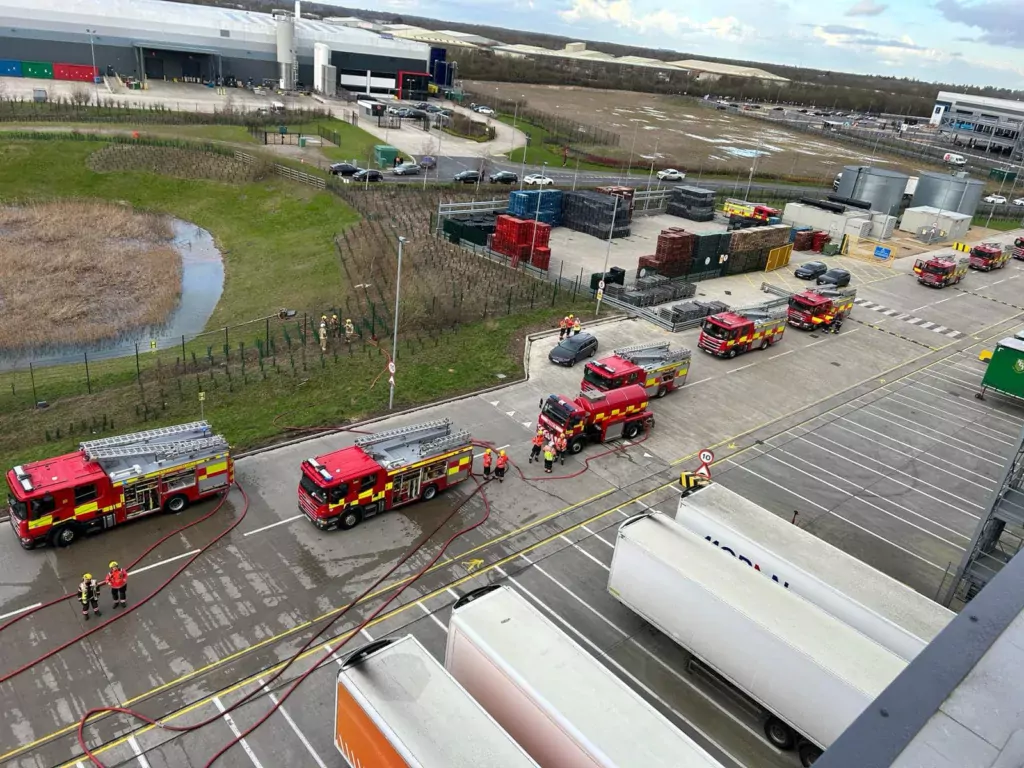 Scenes from today’s fire at the Lidl distribution depot in Peterborough. At one stage some 60 firefighters were brought in to tackle – and contain – the fire after solar panels on the roof caught fire. PHOTOS: Terry Harris for CambsNews and Cambridgeshire Fire and Rescue 