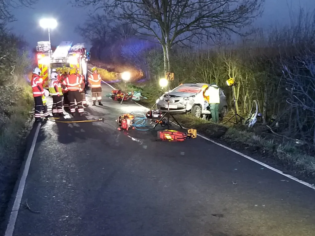 Emergency services at the scene of a crash in Yelling, Cambridgeshire, when a car came off the road and hit a tree.