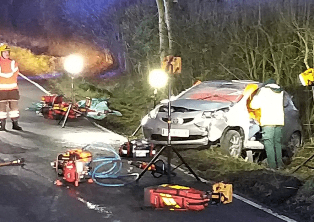 Emergency services at the scene of a crash in Yelling, Cambridgeshire, when a car came off the road and hit a tree.