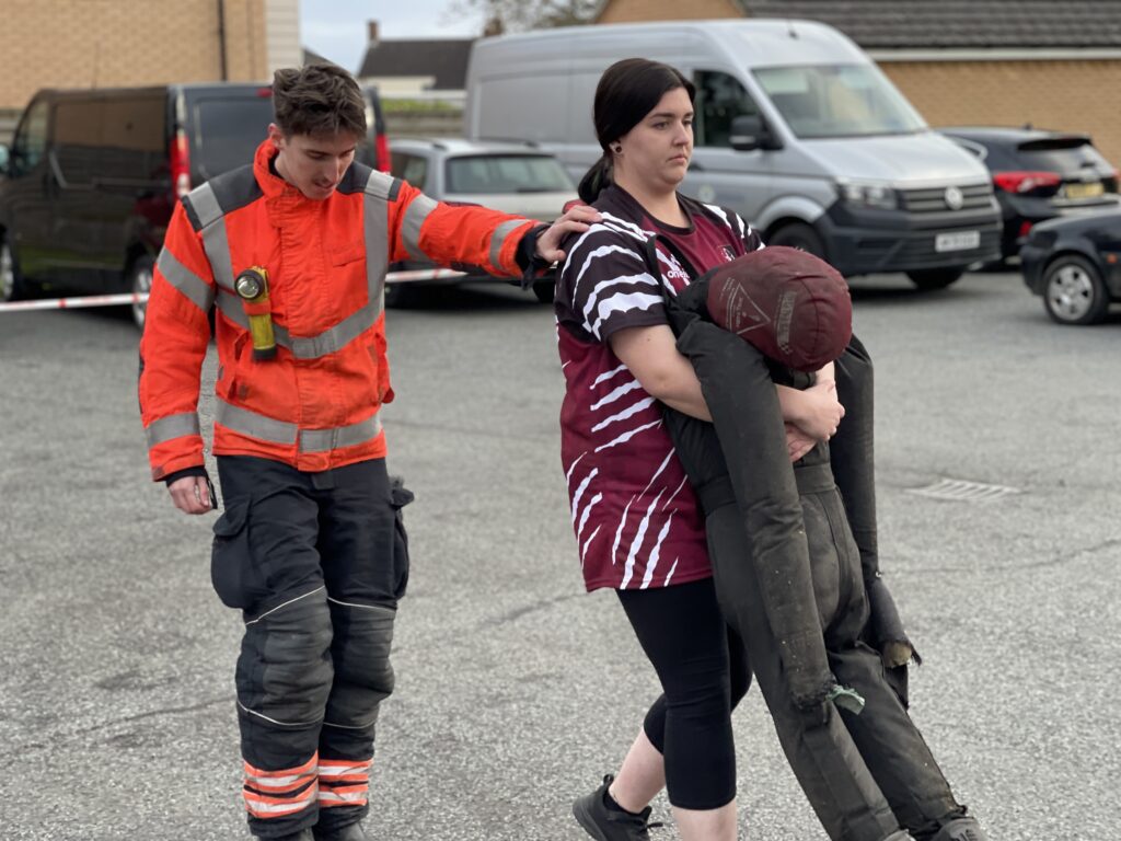 The women’s team of March Bears Rugby Club learn some basic fire fighter techniques during a visit to March Fire Station. PHOTO: Cambs Fire and Rescue