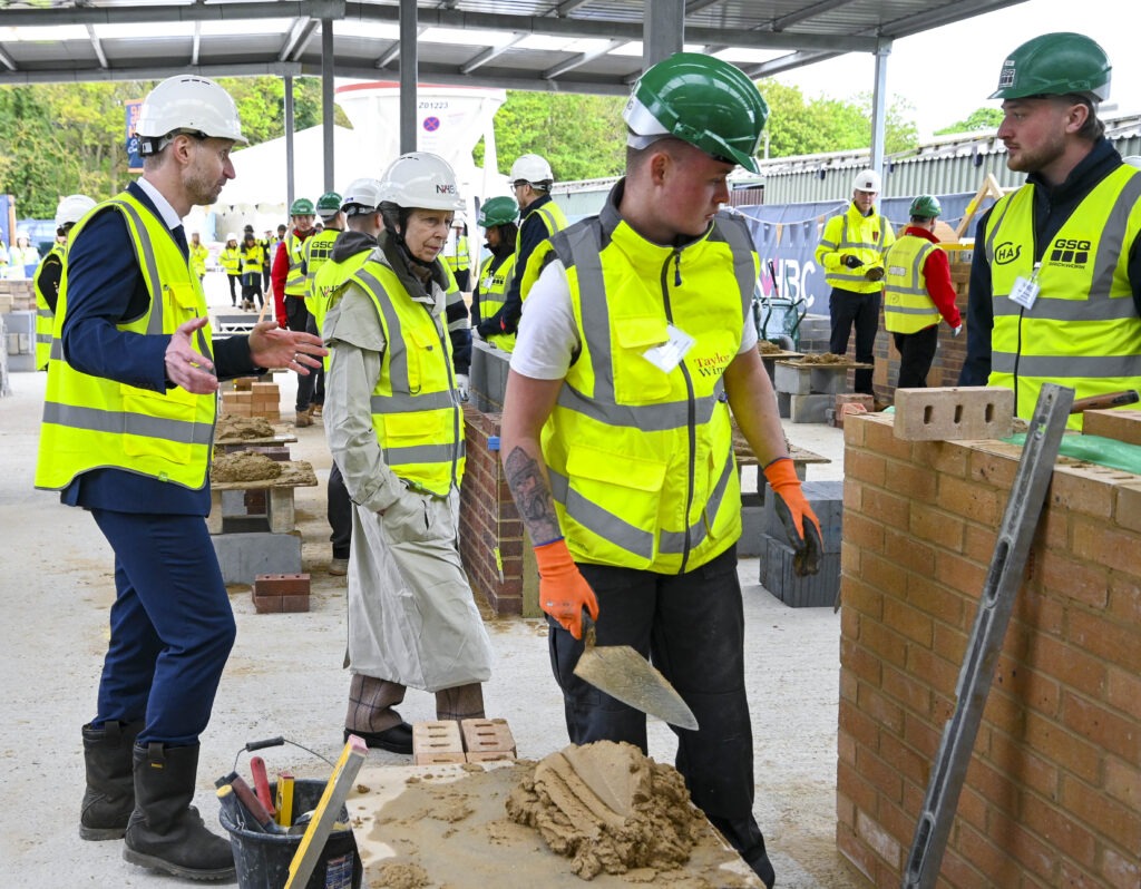 The Princess Royal officially opens the NHBC Training Hub, adjacent to Histon Football Club, Impington, Cambridge; it can train 80 apprentices all year round. PHOTO: NHBC 