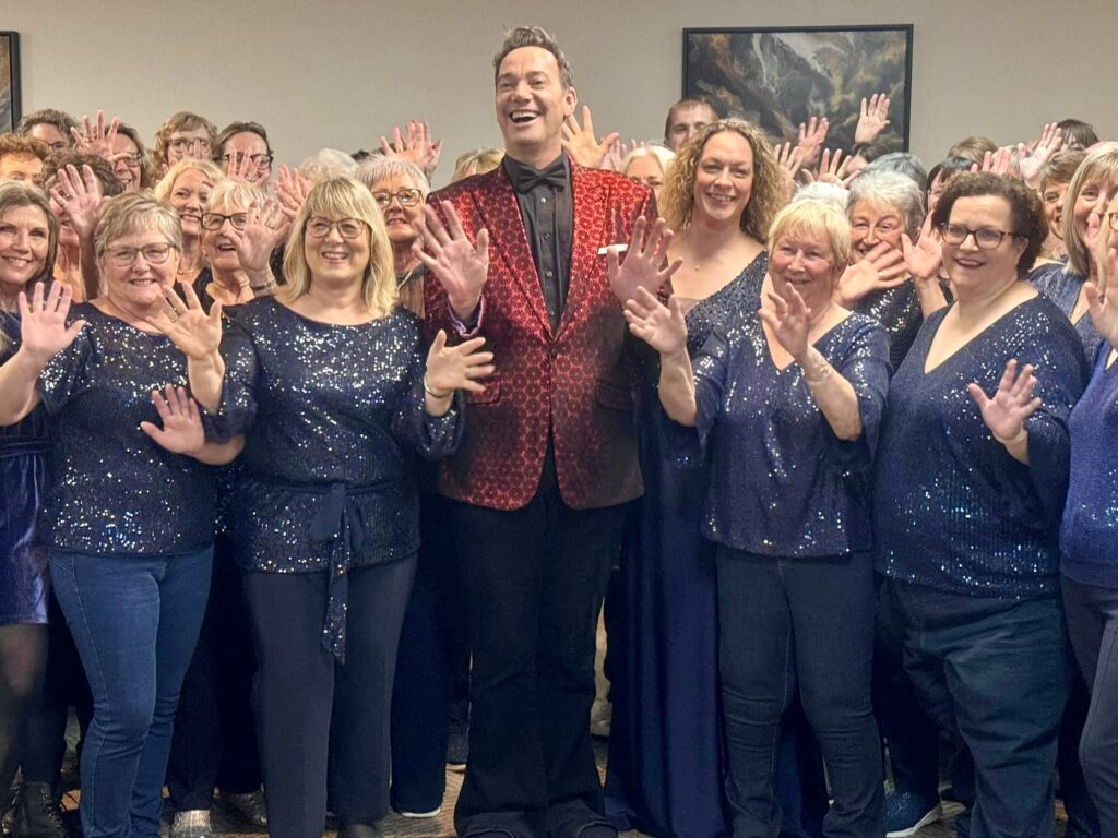 • Craig Revel Horwood surprises the Collaboration Choir during their rehearsal on the night.