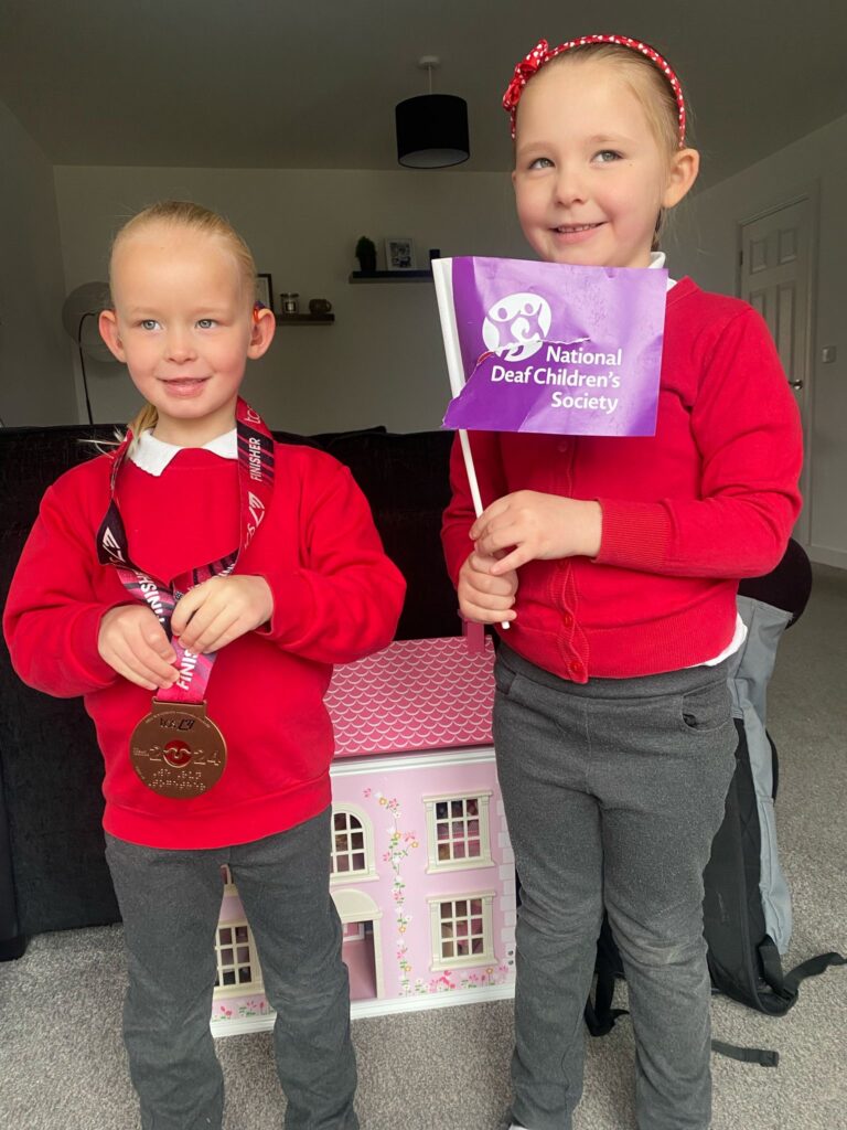Joe and Ricky chose to run for the National Deaf Children’s Society because Ricky’s daughter, Indie, 4, (left) was born deaf and also has cerebral palsy. She and her family have been receiving ongoing support from the charity. Harlow is pictured with Indie.