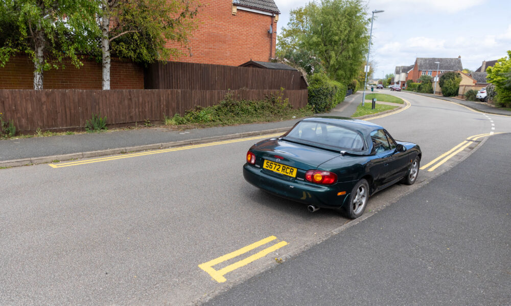 County council contractors plan a return visit to Witchford near Ely to complete installation of yellow lines. They missed some spots because cars were parked there when they came to carry out the lining. PHOTO: Terry Harris