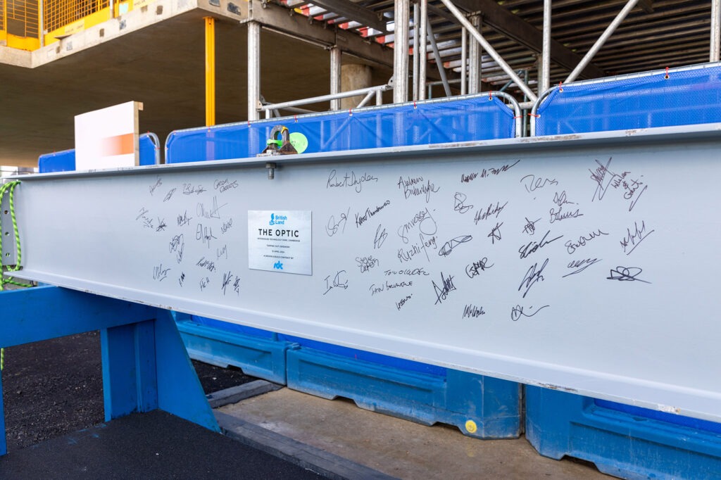 Cambridge City Council members heard speeches from leadership at building contractor, SDC, Peterhouse College and British Land. Guests from the council and project team were also invited to sign the development’s final beam before it was lifted to the roof for fitting. 