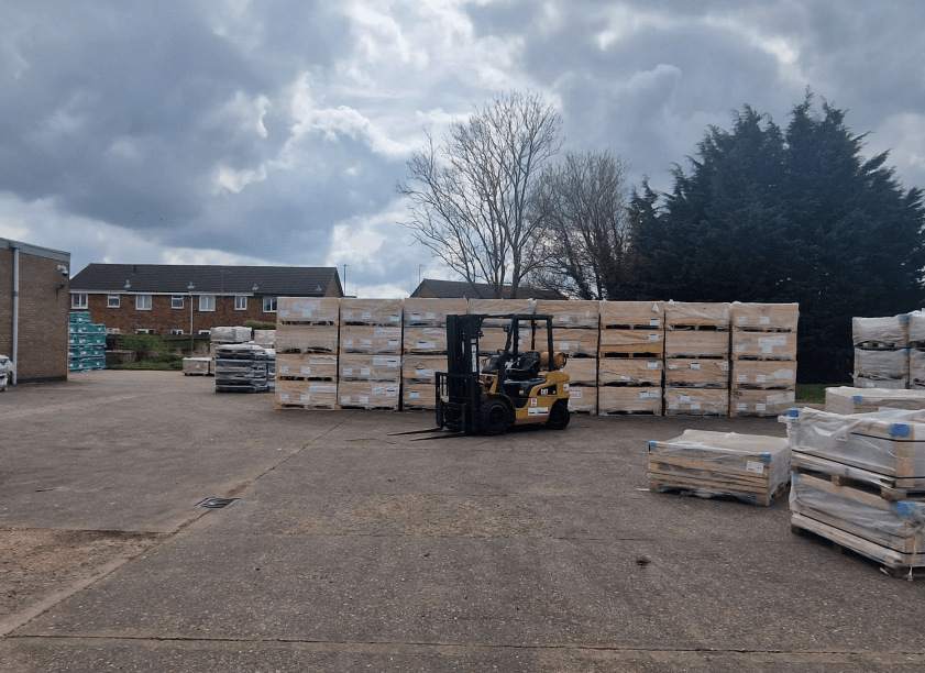 News for Peterborough and Cambridgeshire - Photo of the pallets stacked outside 3-5 Prospect Way, Chatteris, which have been ordered to be removed after businessman loses appeal against Fenland Council decision
