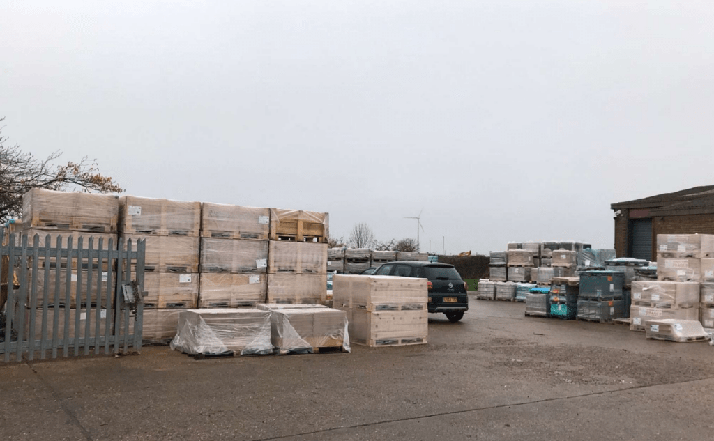 Photo of the pallets stacked outside 3-5 Prospect Way, Chatteris, which have been ordered to be removed after businessman loses appeal against Fenland Council decision 