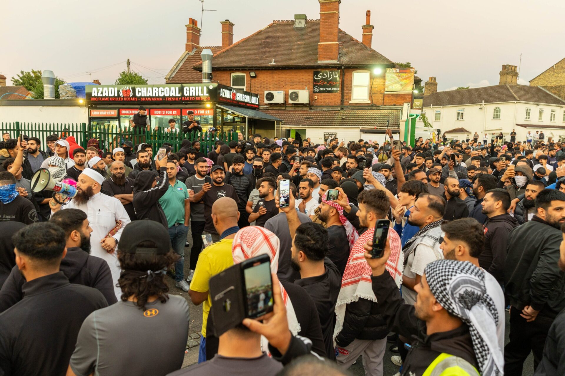 Anti Protestors congregate on Lincoln road following threats to burn a local Immigration centre. - News for Peterborough and Cambridgeshire News for Peterborough and Cambridgeshire - ‘Peterborough riots are so peaceful it’s just showing y’all what’s community spirit,’ wrote one man. Counter protestors congregate on Lincoln Road following social media threats to burn a local immigration centre. Millfield, Peterborough Wednesday 07 August 2024. PHOTO: Terry Harris.