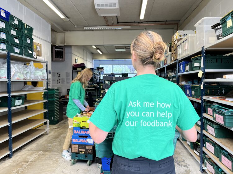 food bank - News for Peterborough and Cambridgeshire News for Peterborough and Cambridgeshire - Photo caption: Food being processed inside the Cambridge City Foodbank warehouse