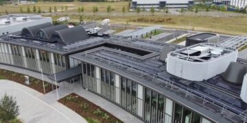 Cambridgeshire County Council is using the new Shire Hall HQ carports as one example of its net zero goal. The solar carports which provide electricity to the building alongside the rooftop solar photovoltaic panels on top of New Shire Hall. The carports power EV charging points. IMAGE: RG Carter