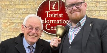 Mayor Cllr Chris Phillips stands with Matthew Routledge, Town Crier of Ely, outside of Oliver Cromwell’s House, Ely, Cambridgeshire