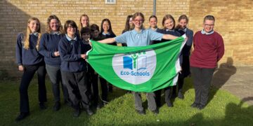 The Impington Village College Eco-Committee holding the Eco-Schools Green Flag