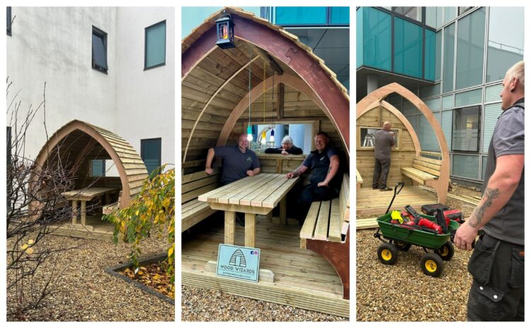 pods main - News for Peterborough and Cambridgeshire News for Peterborough and Cambridgeshire - Jennie Grainger – Lead Volunteer Gardener and Staff Reflection Garden designer – with some of the Wood Wizards team installing the pods at Peterborough City Hospital