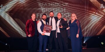 Adam and Nathan Holmes and Andy Blackhurst receive their award