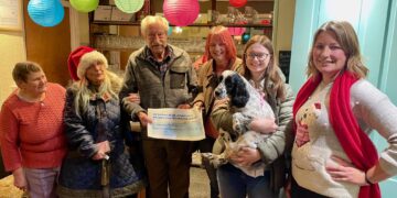 Julie Judy and Charlie from Ravenswood Pet Rescue receive their cheque from Club President Fred Clarke, with Club Chairman Sara Fleming and Vice-Chair Janice Willis.