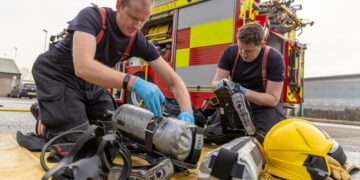 Assistant director of Cambridgeshire Fire and Rescue, Wayne Swales spoke to CambsNews on Tuesday at Huntingdon Fire Station where he oversaw the roll out of what has been described as a “new concept” fire appliance. Cambs Fire also explained why they are asking for a Council Tax increase. Pictured Fire Fighters Ross Turner and Daniel Fielding. Huntingdon Fire Station showcase new concept fire appliance. PHOTO: Terry Harris