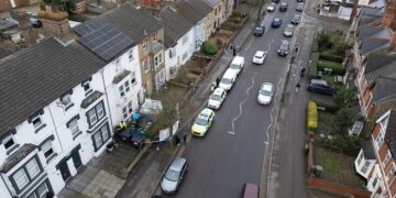 Police guard house on Lincoln Road after the sudden death of a man found on street. Lincoln Road, Peterborough Thursday 20 February 2025. Picture by Terry Harris.