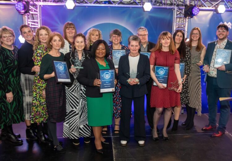 News for Peterborough and Cambridgeshire - Spotlight Award winners pose with their awards - image credit to Cambridgeshire County Council.