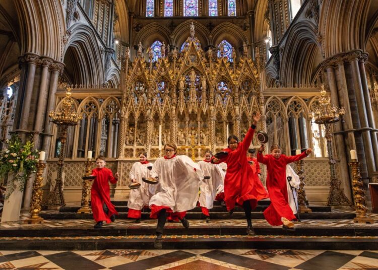 p 19 - News for Peterborough and Cambridgeshire News for Peterborough and Cambridgeshire - Choristers from Ely Cathedral putting in some practice for this year’s pancake race which was held on Shrove Tuesday (March 4) IMAGE: BavMedia