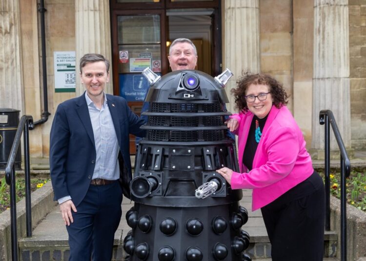 who 17 - News for Peterborough and Cambridgeshire News for Peterborough and Cambridgeshire - Let the magic begin. MP Andrew Pakes, city council leader Dennis Jones and Cllr Anna Smith, deputy mayor of the Cambridgeshire and Peterborough Combined Authority, were together at Peterborough Museum as early preparations for this summer’s major exhibition – Adventures in Time and Space – got under way. And of course, a Dalek made an impromptu appearance. PHOTO: Terry Harris