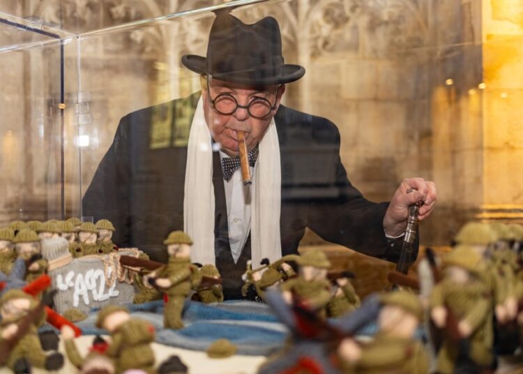 News for Peterborough and Cambridgeshire - Peterborough Cathedral had some ‘unexpected’ guests posing as historical figures – including Winston Churchill – at the opening of The Longest Yarn exhibition, a breathtaking 80-metre-long portrayal of D-Day through the art of knitting and crochet. PHOTO: Terry Harris
