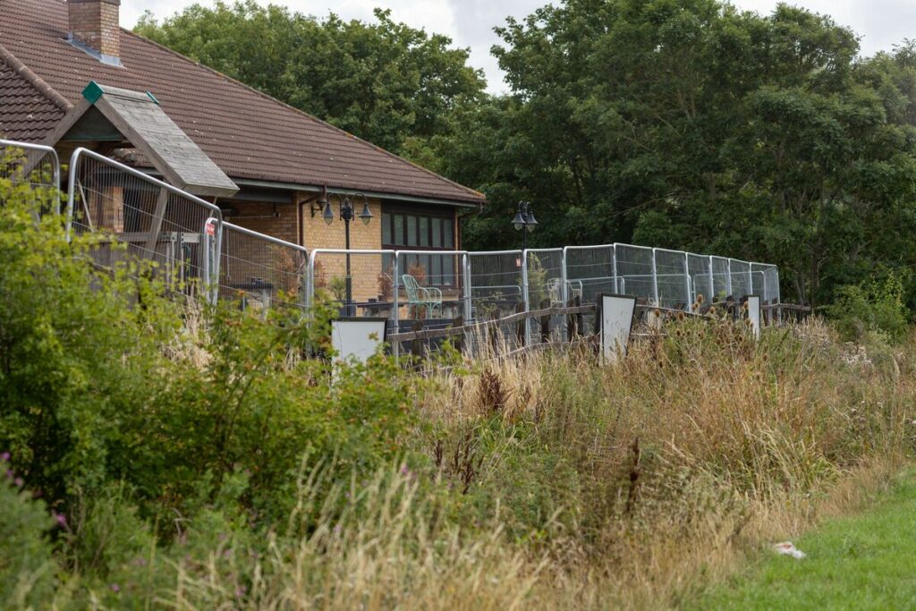 RS41279_THS-Peterborough-Dragon-Asylum-Hotel-Fenced-15546_scr - News for Peterborough and Cambridgeshire FOI requests by the BBC and The Times found that the Home Office pays millions each month to private security firms (like Mitie, G4S, or Serco’s own staff) to patrol sites such as the Dragonfly hotel in Peterborough. PHOTO: Terry Harris