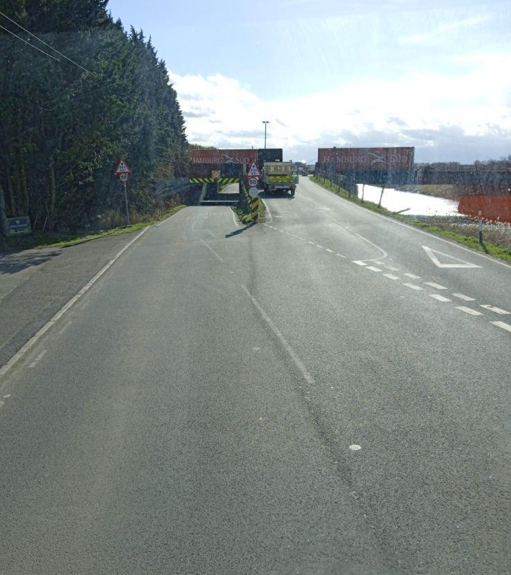 stonea 14 - News for Peterborough and Cambridgeshire Vehicles approaching the bridge on the B1098 at Stonea from the north or south must contend with a low railway bridge — an underpass notorious for collisions with traffic, often vans. To one side lies a level crossing where road traffic must stop for passing trains. Between the bridge, the crossing, and the riverbank running alongside, the site is a knot of potential hazards.