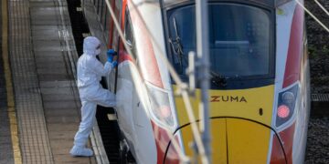 Police at the scene of last night’s stabbing at Huntingdon rail station. One man has been arrested on suspicion of attempted murder. Image: Terry Harris