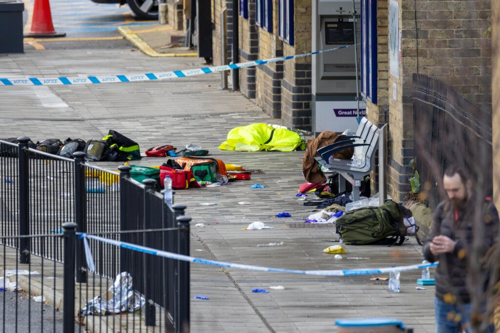 Police at the scene of last night’s stabbing at Huntingdon rail station. One man has been arrested on suspicion of attempted murder. Image: Terry Harris