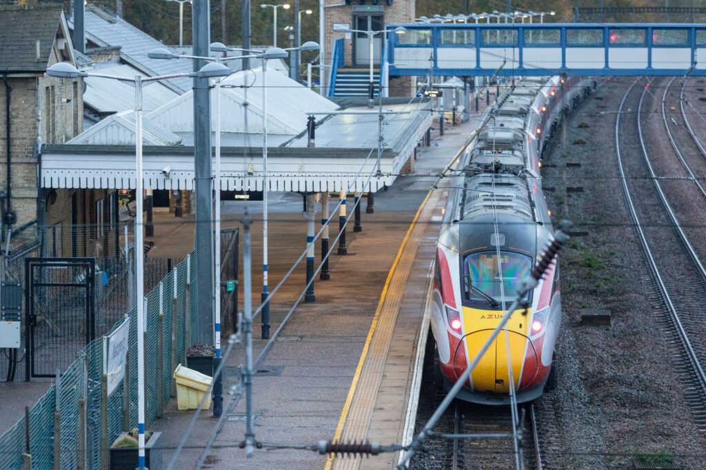train 1 - News for Peterborough and Cambridgeshire A 32-year-old man is the sole suspect in a stabbing on a Doncaster–London train Saturday evening. An LNER staff member who tried to stop the attack remains in life-threatening condition, while five others have been discharged. British Transport Police praised the worker’s “heroic” actions, saying they saved lives. Armed officers boarded the diverted 18:25 service to Huntingdon after passenger calls at 19:40 GMT. IMAGE: Terry Harris