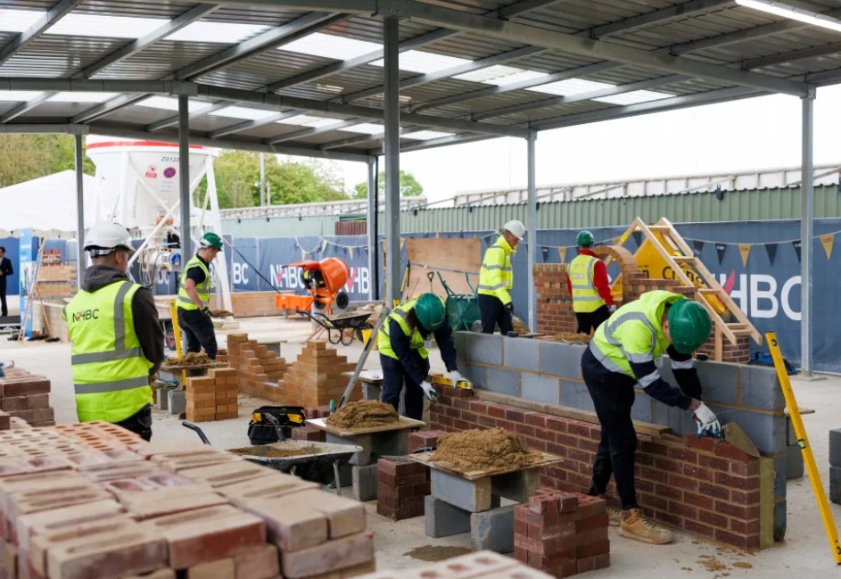 Apprentices working at an existing, smaller NHBC Training Hub in Cambridge, which is training the next generation of skilled housebuilders in just 14 to 18 months.