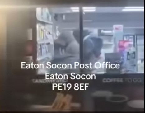 “Look at these lots, robbing post office, getting everything taking all the alcohol and lot” says an onlooker as he filmed outside Eaton Socon post office and Premier store, Eaton Socon, Cambridgeshire. His video has been seen 12,000 times on Facebook.