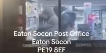 “Look at these lots, robbing post office, getting everything taking all the alcohol and lot” says an onlooker as he filmed outside Eaton Socon post office and Premier store, Eaton Socon, Cambridgeshire. His video has been seen 12,000 times on Facebook.