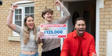 STUNNED: Beaming Ben with partner Chloe and lottery’s Danyl Johnson