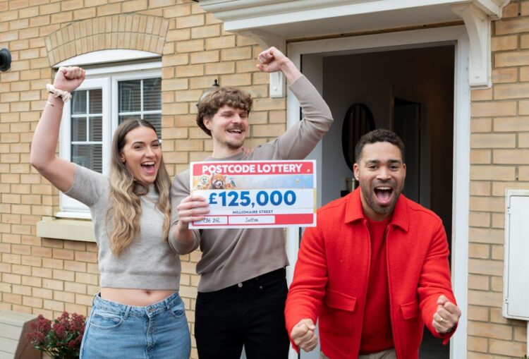 STUNNED: Beaming Ben with partner Chloe and lottery’s Danyl Johnson