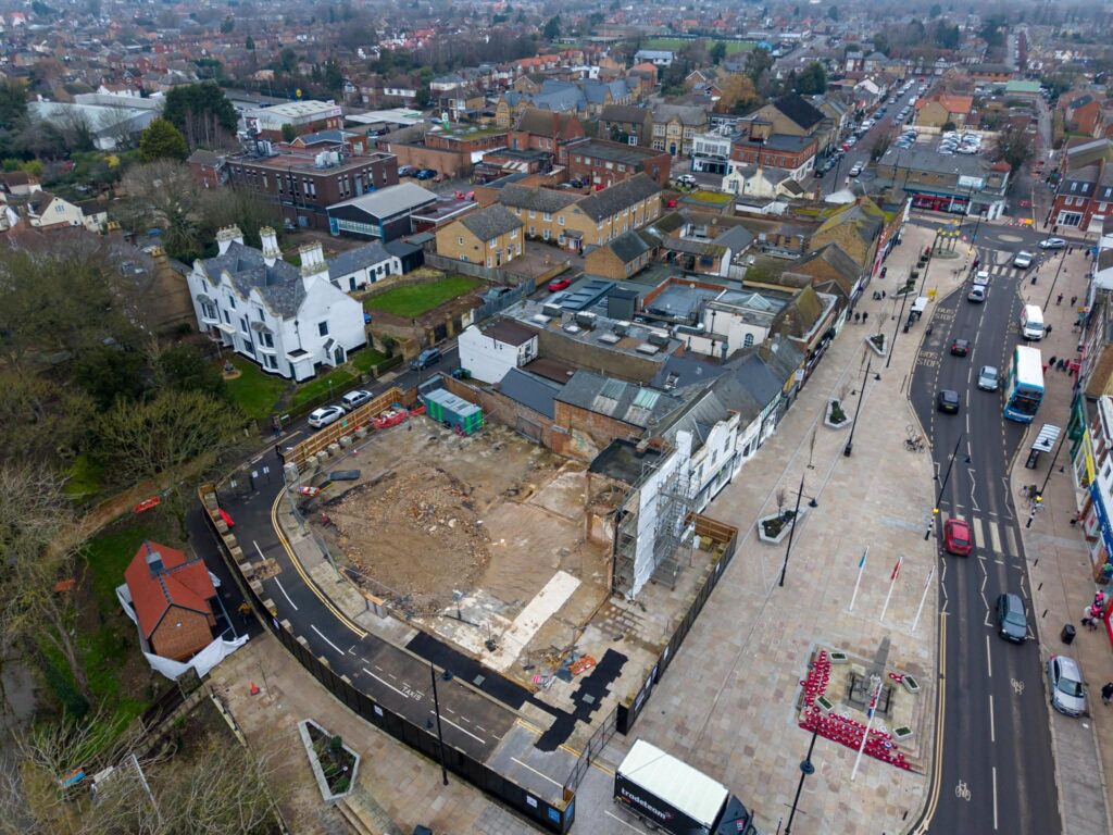 Exclusive CambsNews photos show the aftermath of demolition of the former Barclays Bank in March: a vast, fenced-off hole on Broad Street, next to the war memorial, where a landmark building once stood. PHOTO: Terry Harris