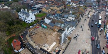 Exclusive CambsNews photos show the aftermath of demolition of the former Barclays Bank in March: a vast, fenced-off hole on Broad Street, next to the war memorial, where a landmark building once stood. PHOTO: Terry Harris