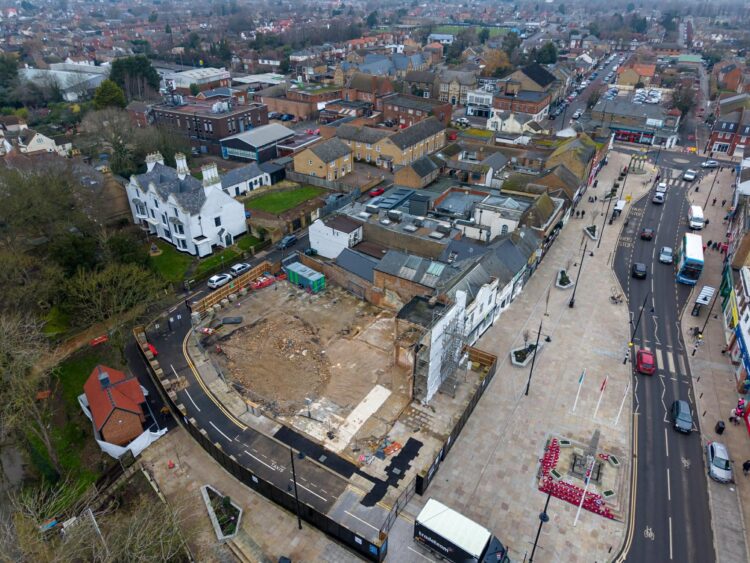 Exclusive CambsNews photos show the aftermath of demolition of the former Barclays Bank in March: a vast, fenced-off hole on Broad Street, next to the war memorial, where a landmark building once stood. PHOTO: Terry Harris